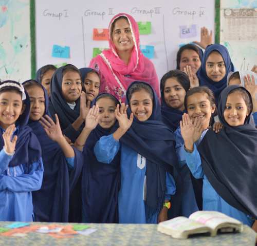Primary school students and their teacher in a Punjab classroom — British Council EaSTE policy paper